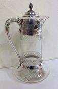 A large attractive silver mounted cut glass claret