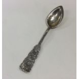A good quality Sterling silver spoon chased with h