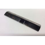 LIBERTY & CO: A stylish silver comb with reeded de