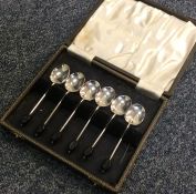 A boxed set of six bean top coffee spoons. Birming