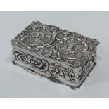 A chased rectangular silver box decorated with fig