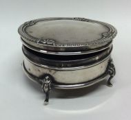 An Edwardian silver jewellery box of circular form