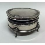 An Edwardian silver jewellery box of circular form