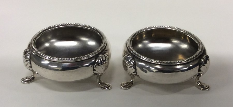 A pair of Victorian circular silver salts with bea