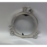 A decorative circular silver plain picture frame w