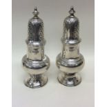 A pair of good quality silver sugar casters of Geo