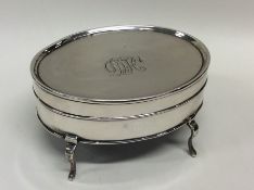 A good oval silver jewellery box with gilt interio