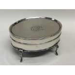 A good oval silver jewellery box with gilt interio