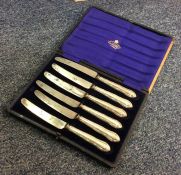 A cased set of six silver handled tea knives. Appr