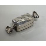 A novelty silver pill box in the form of a sweet w
