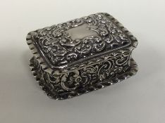 A rectangular silver hinged top box with crimped r