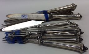 A set of twelve silver handled dessert knives of t