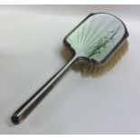 A large silver and enamelled brush decorated with