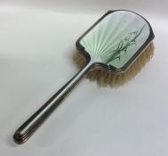 A large silver and enamelled brush decorated with