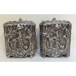 A rare pair of George II silver tea caddies profus