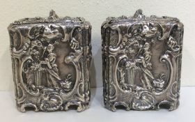 A rare pair of George II silver tea caddies profus
