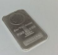 A small fine silver 1 ounce bar. Est. £25 - £35.