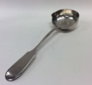 A Russian silver spoon with pouring lip. Punched,
