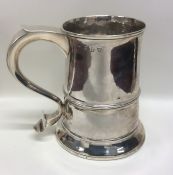 A good George III tapering silver quart mug on spr