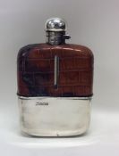 A large silver and glass hip flask with crocodile