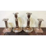 Two pairs of silver plated candlesticks. Est. £20