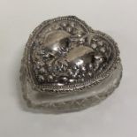 A heart shaped silver and hobnail cut dressing tab