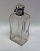 A rectangular glass mounted hinged top scent bottl