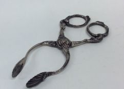 A pair of unusual 18th Century silver sugar nips o