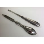 Two silver handled manicure implements. Approx. 28