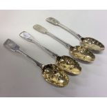 Four silver and silver gilt berry spoons. London.