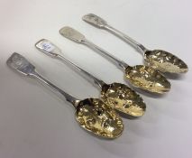 Four silver and silver gilt berry spoons. London.