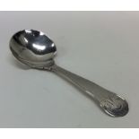 An Antique silver Provincial caddy spoon with scro