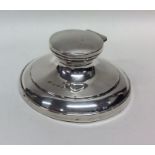 A circular hinged top silver inkstand. Birmingham