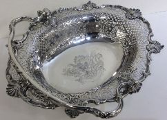 A heavy George II silver cake basket, the body hea