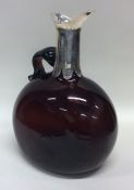 A heavy large Victorian red glass claret jug with