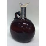 A heavy large Victorian red glass claret jug with