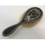 A good tortoiseshell and silver mounted hairbrush