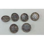 A set of six Chinese silver buttons with chased bo