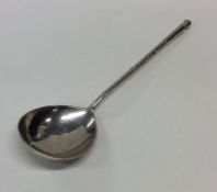 A Russian silver spoon engraved with flowers and l