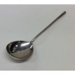 A Russian silver spoon engraved with flowers and l