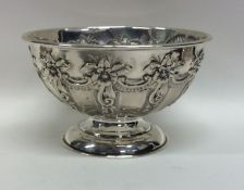 An attractive embossed silver sugar bowl decorated