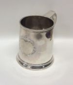 A good George I tapering silver mug on spreading b