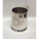 A good George I tapering silver mug on spreading b