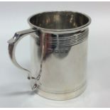 An Edwardian silver tapering mug with reeded sides