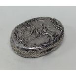 A small Continental silver chased box decorated wi
