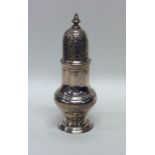 A good Georgian silver baluster shaped sugar caste