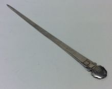 An 18th Century silver meat skewer with crested te