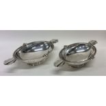A pair of stylish silver bonbon dishes of shaped f