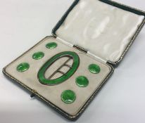 A good cased silver and enamelled buckle together