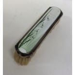 A small attractive silver and enamelled brush deco